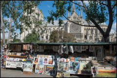 Bouquinistes is the name given to Paris street booksellers. This one is situated on the Quai de Montebello with the Notre-Dame cathedral in the background.