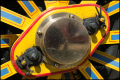 A colourful wheel on a showmans engine at the Great Dorset Steam Fair, Dorset.