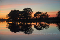 Sunset at Hatchet Pond near Beaulieu in the New Forest, Hampshire, England.