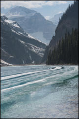 View across a frozen Lake Louise to the Victoria Glacier, Banff National Park, Alberta, Canada.