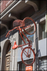 An old bicycle used as a display on the side of a building in the old town area of Montevideo, Uruguay.