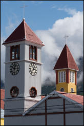 Colourful clock towers of churches in Ushuaia, Argentina.