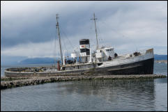 Ushuaia, Argentina - The grounded and abandoned rescue tug St Christopher, formerly HMS Justice is now a tourist attraction on the waterfront adjacent to the harbour.